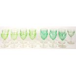 TWO SETS OF SEVEN AND EIGHT FLUTED GREEN GLASS WINE GLASSES, 12CM H AND CIRCA, LATE 19TH / EARLY
