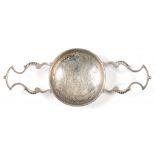 A GEORGE II SILVER ORANGE OR LEMON STRAINER, 35CM W OVER HANDLES, MARKS RUBBED, LONDON, PROBABLY