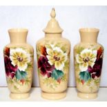 A LATE 19TH C OPAQUE FAWN GLASS GARNITURE, BOLDLY PAINTED WITH FLOWERS, VASE AND COVER 41CM H