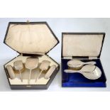 A GEORGE V SILVER HAND MIRROR AND MATCHING HAIR BRUSH, BIRMINGHAM 1922, CASED AND A SILVER SIX PIECE