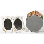 A BARBOLA MIRROR, 26CM H AND A PAIR OF CONTINENTAL FLORAL PORCELAIN PHOTOGRAPH FRAMES