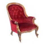 A VICTORIAN WALNUT ARMCHAIR, C1860, in later buttoned red upholstery, 97cm h++Minor chips and