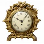 AN EARLY VICTORIAN ROCOCO REVIVAL GILTWOOD TIMEPIECE, C1850, the painted dial with gothic