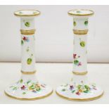 A PAIR OF ENGLISH PORCELAIN CANDLESTICKS, PAINTED WITH SPRAYS AND SCATTERED FLOWERS AND LEAVES, GILT
