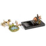 A COLD PAINTED BRONZE MINIATURE SCULPTURE OF A HUNTSWOMAN ON HORSEBACK, MOUNTED ON A SLATE TRAY,