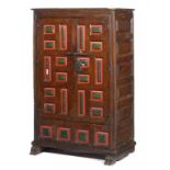 A CONTINENTAL PAINTED SOFTWOOD CUPBOARD, 18TH C, of geometric panelled form, the moulded cornice