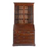 A GEORGE III MAHOGANY BUREAU BOOKCASE, C1780 the slightly later associated bookcase with stepped