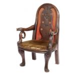 AN UNUSUAL BRITISH VERNACULAR OAK ELBOW CHAIR, 19TH C, the padded back with carved splat in the form