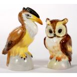 A PAIR OF ROYAL CROWN DERBY OWL AND PELICAN NOVELTY SALT AND PEPPER CASTERS, 7.5 AND 9CM H, GREEN