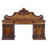 A VICTORIAN MAHOGANY SIDEBOARD, C1870, applied with boldly carved C scrolls and flowers forming