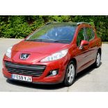 MOTOR CAR. A RED PEUGEOT 207 SW SPORT HDI, 2009