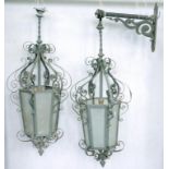 A PAIR OF VICTORIAN WROUGHT IRON HANGING LANTERNS, WITH ONE BRACKET, 85CM