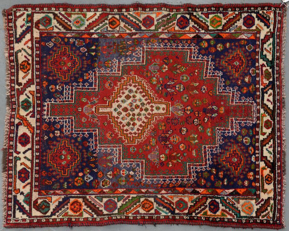 A RUG, 117 X 152CM AND A CAUCASIAN SADDLE BAG, 80 X 170CM