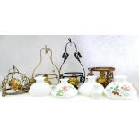 FOUR VARIOUS BRASS HANGING OIL LAMPS, EARLY 20TH C AND WHITE GLASS LAMPSHADES, VARIOUS SIZES