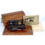 A GUYS CALCULATING MACHINES LIMITED BRITANNIC CALCULATOR, ON WOOD BASE, WITH LAMINATE WOOD COVER,