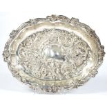 A VICTORIAN EMBOSSED AND SHAPED OVAL SILVER DISH, 29CM W, CHESTER 1894, 10OZS 10DWTS