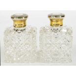 A PAIR OF VICTORIAN SILVER GILT CAPPED CUT GLASS TOILET BOTTLES, 9CM H