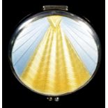 AN ART DECO SILVER AND ENAMEL COMPACT, THE ROUND LID WITH RADIATING YELLOW AND PALE GREY BLUE