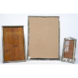 THREE SILVER PHOTOGRAPH FRAMES, LARGEST 34.5 X 25.5CM, VARIOUS MAKERS AND DATES, BIRMINGHAM, EARLY