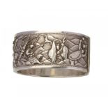 A CHINESE EXPORT SILVER REPOUSSE BANGLE, C1900 decorated to either side with groups of figures, 57 x