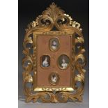 A CARVED AND GILDED FRAME OF FRENCH PORTRAIT MINIATURES OF NAPOLEON AND THREE IMPERIAL LADIES,