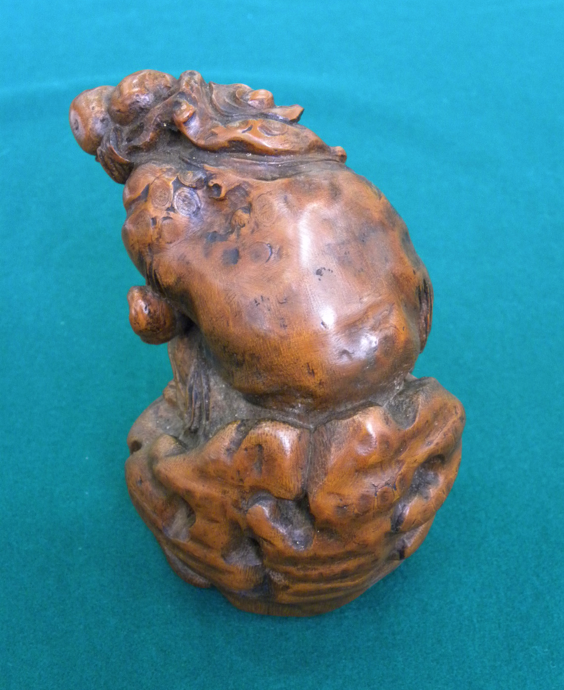 A CHINESE CARVED BAMBOO FIGURE OF SHOU-LAO on a rock, holding a peach bough in his left hand and - Image 3 of 4