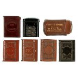 VARIOUS MATERIALS. FOUR SIMILAR VULCANITE BOOK SHAPED VESTA CASES, LATE 19TH/EARLY 20TH C 5cm, one