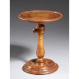 AN ENGLISH LACE WOOD CANDLE STAND, 19TH C with dished adjustable top, baluster pillar and lead