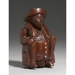 TREEN. A CARVED WOOD SNUFF BOX IN THE FORM OF A SEATED MAN, GERMAN OR DUTCH, EARLY 19TH C 9cm h++