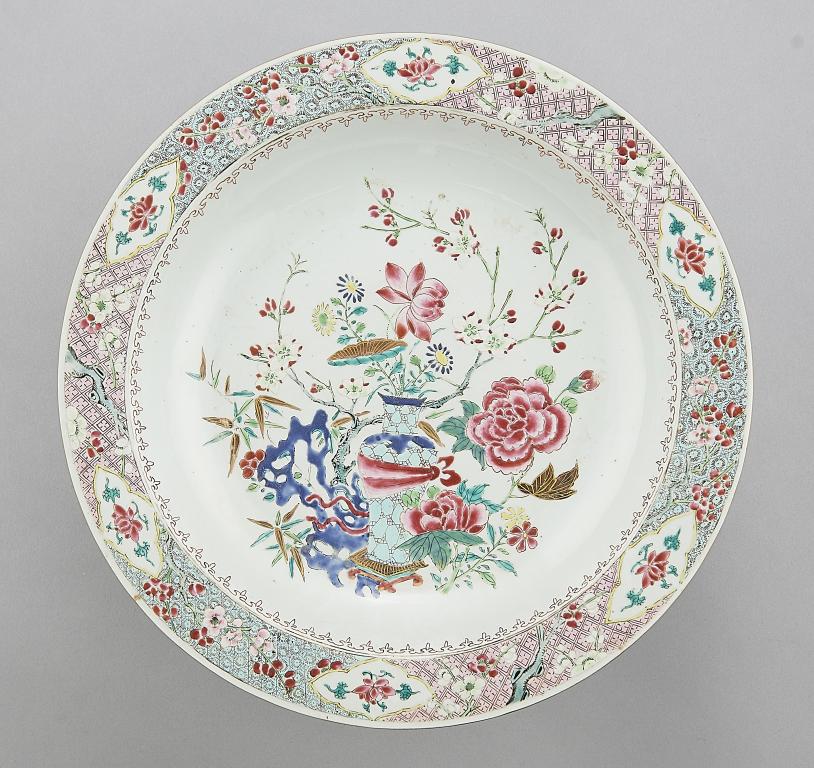 A CHINESE FAMILLE ROSE DISH, C 1770 enamelled with peony and other flowers, a blue hollow rock and