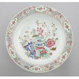 A CHINESE FAMILLE ROSE DISH, C 1770 enamelled with peony and other flowers, a blue hollow rock and