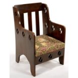 GOODYERS OF REGENT STREET. AN ARTS AND CRAFTS STAINED OAK ARMCHAIR, C1905, WITH THREE SPLATS, THE