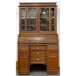 AN OAK BUREAU BOOKCASE WITH TAMBOUR SHUTTER, EARLY 20TH C, 188 X 105CM