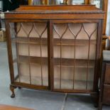 A MAHOGANY BOW FRONTED CHINA CABINET, 120CM W