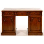 A VICTORIAN GOTHIC OAK DESK, LATE 19TH C, THE RECTANGULAR TOP WITH OVOLO LIP AND FITTED WITH THREE