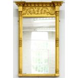 A REGENCY GILTWOOD AND COMPOSITION PIER MIRROR, WITH BREAKFRONT CORNICE, 91CM H