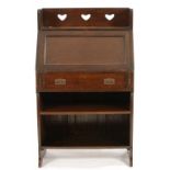 LIBERTY & CO. A STAINED OAK CHAUCER BUREAU, C1905-10, THE GALLERY PIERCED WITH THREE HEARTS, THE
