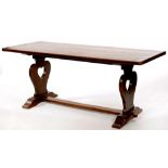 BATH CABINET MAKERS. AN ARTS AND CRAFTS OAK DRAW LEAF DINING TABLE, C1910, THE TOP WITH CARVED