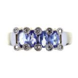 A TANZANITE AND DIAMOND 14CT WHITE GOLD RING. MAKERS MARK IW, BIRMINGHAM, 3.2G, SIZE M ++GOOD