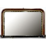 A LATE VICTORIAN WALNUT, EBONISED AND GILT OVERMANTEL MIRROR, 87CM W