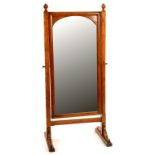 AN ENGLISH REFORMED GOTHIC STYLE OAK CHEVAL MIRROR, LATE 19TH C, WITH CHAMFERED UPRIGHTS, 147CM H,