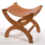 A MOUSEMANN OAK X-FORM STOOL, CIRCA THIRD QUARTER 20TH C, WITH TAN LEATHER SLING SEAT, 52CM H,