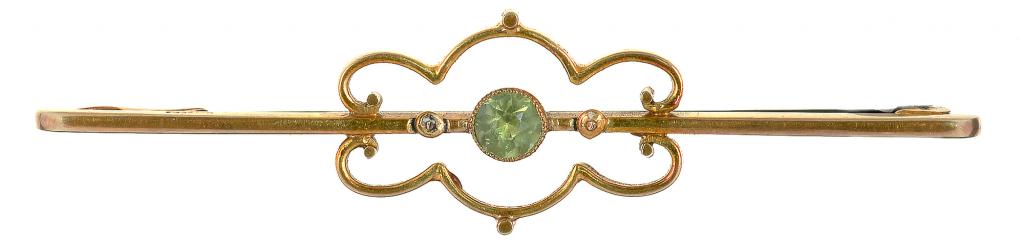 A PERIDOT SET BROOCH IN GOLD, MARKED 15CT, BOXED, D 57 MM, 3.8G