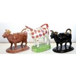 TWO 19TH C EARTHENWARE COW CREAMERS AND COVERS IN JACKFIELD OR ROCKINGHAM BROWN GLAZES, 12CM H AND