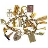 A GOLD CHARM BRACELET, TWO CHARMS MARKED 14CT, 44G