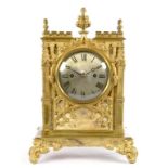 A VICTORIAN GOTHIC BRASS MANTEL CLOCK, THE SILVERED DIAL ENGRAVED BRYSON EDINBURGH, HAVING TWIN