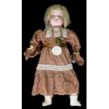 A GERMAN BISQUE HEADED CHARACTER DOLL, THE ARMAND MARSEILLE HEAD WITH HAZEL GLASS SLEEPING EYES,