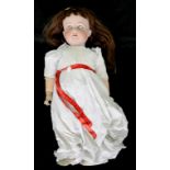 A GERMAN BISQUE HEADED CHARACTER DOLL, THE ARMAND MARSEILLE HEAD WITH BLUE GLASS SLEEPING EYES, OPEN