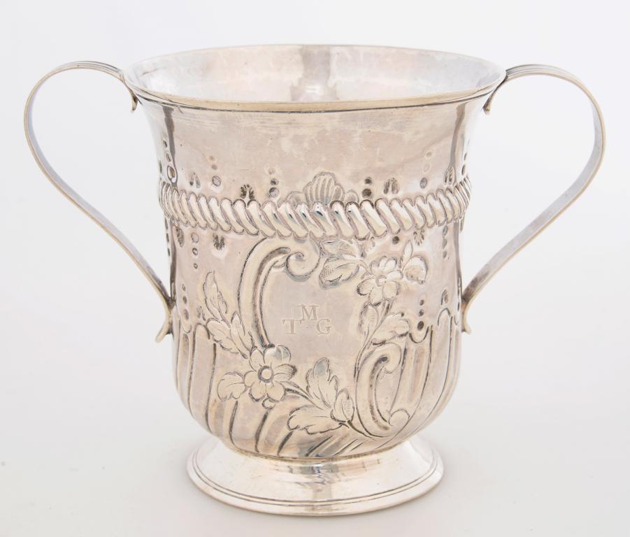 A GEORGE III TWO HANDLED SILVER LOVING CUP, WITH CABLE GIRDLE AND CHASED WITH FLOWERS, THE LOWER