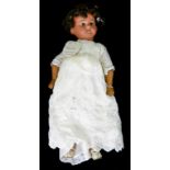 A GERMAN BISQUE HEADED MULATTO DOLL, THE ARMAND MARSEILLE HEAD WITH HAZEL GLASS EYES, OPEN MOUTH